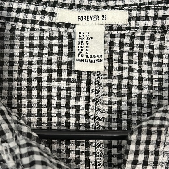 Cute black and white plaid button down with and low toe at the back. - Picture 2 of 3